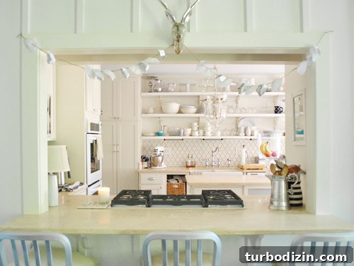 Breezy Bright House: Modern Coastal Home Tour 10 Pass-through decorated with garlands
