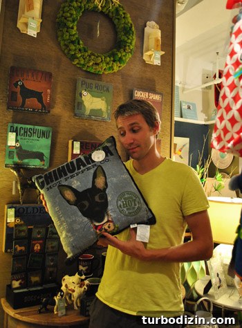 Beachfront Boutiques and Thrift Stores to Explore 22 John holding a chihuahua pillow