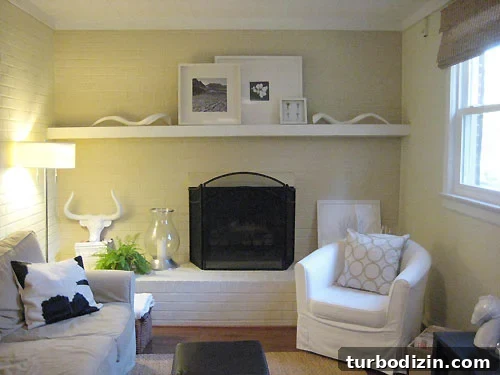 family-room-before-and-after Ceramic horns soften mantel display
