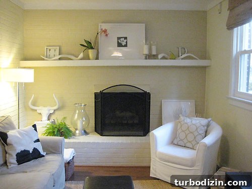 dressing-up-the-den Personal items on mantel: framed keys, ceramic pear, silver P