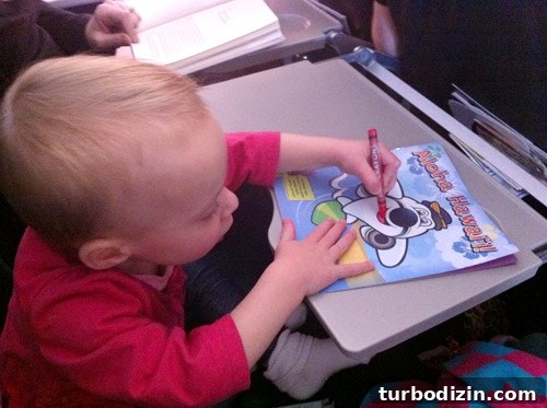 flying with toddler coloring on airplane tray