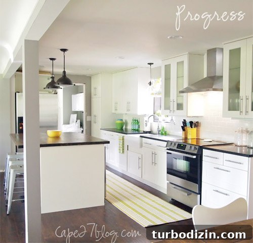 White Kitchen Remodel: White Tile and Butcher Block Island 3 Before and after kitchen photo 2