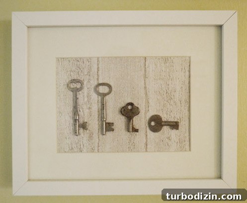 Create Shadowbox Art with Personal Keepsakes 2 Framed vintage keys on wood-grain paper