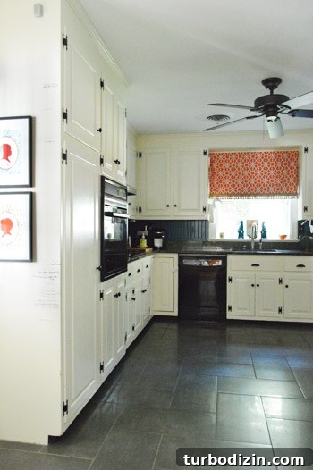 Kitchen with herringbone tile and beadboard backsplash