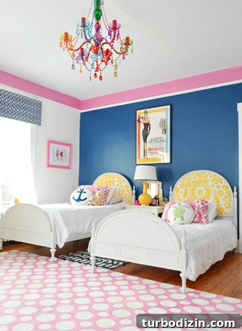 House Crashing: Casual Farmhouse Life and Cozy Renovations 11 Twin Bed Side-By-Side In Blue Room With Pink Border And Colorful Crystal Chandelier