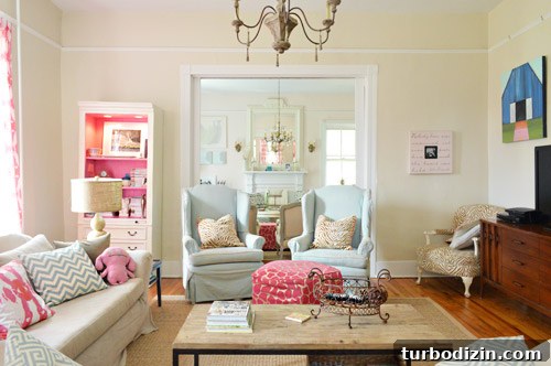 House Crashing: Casual Farmhouse Life and Cozy Renovations 4 Colorful Traditional Farmhouse Living Room With Wingback Chairs And Pink Bookcase