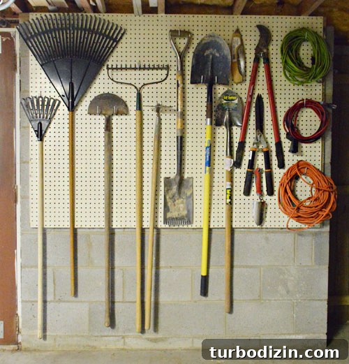 Organize Your Tools with a Pegboard: Smart Workshop Storage Ideas 2 Organized basement tool wall