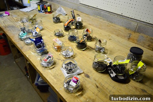 Organize Your Tools with a Pegboard: Smart Workshop Storage Ideas 12 Labeled jars of hardware