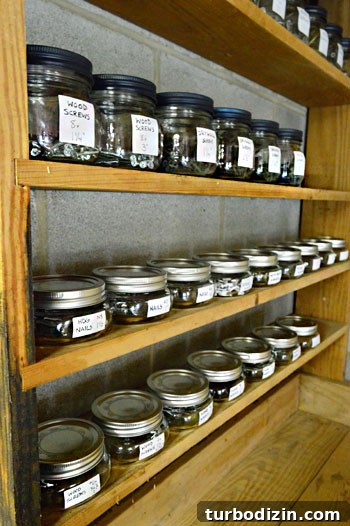 Organize Your Tools with a Pegboard: Smart Workshop Storage Ideas 14 Shelf with labeled hardware jars