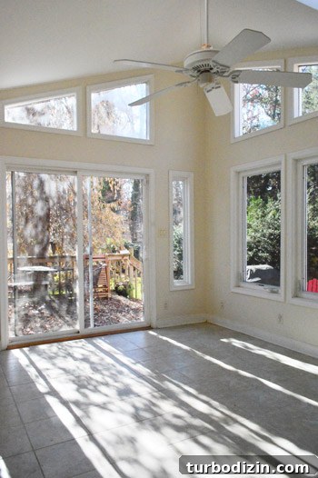 Empty sunroom before rug