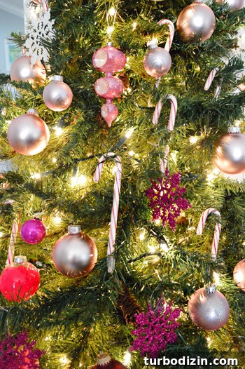 Close UP On Pink And Red Ornaments And Candy Canes On Gradient Christmas Tree
