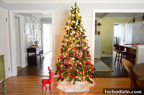 Far View Of Gradient Christmas Tree Sitting Between Hallway And Kitchen