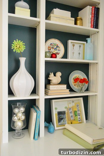 Built-in shelves with holiday accents and teal back wall