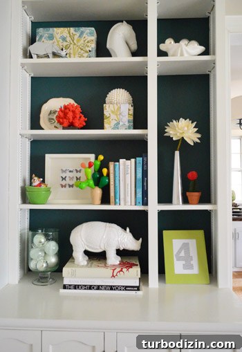 Other side of built-ins with red accents and ornaments