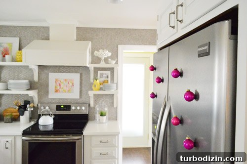 Hot pink magnet ornaments on refrigerator
