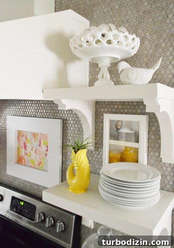 Cake plate filled with silver ornaments on open shelving