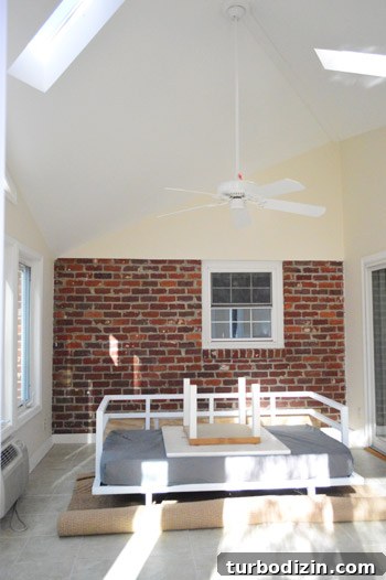 How to Paint Very High Vaulted Ceilings Safely and Efficiently 2 Sunroom furniture piled in center