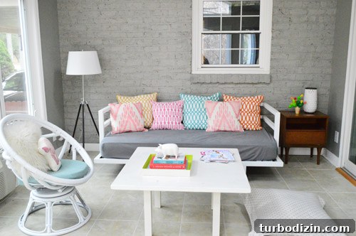 Daybed and cushions in painted sunroom