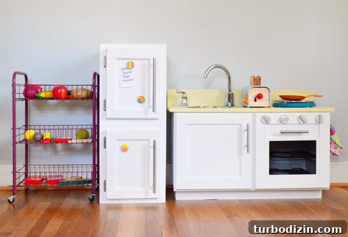Turn an Old Cabinet Into a Realistic Play Refrigerator for Kids 12 Finished fridge next to play kitchen