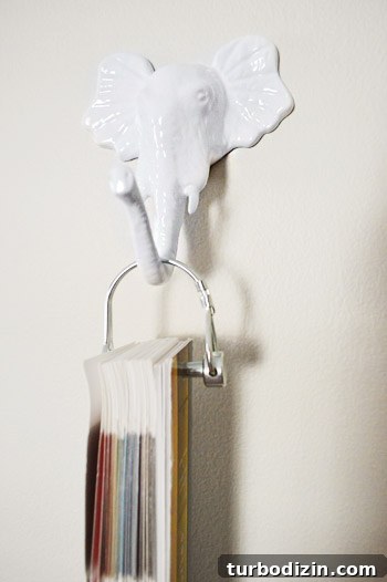 Framing Kids’ Clothes and Adding Playful Wall Hooks for Decor 12 Hooks holding bows and toys