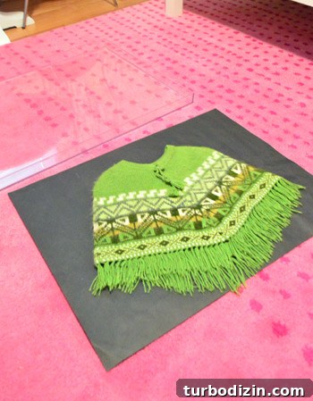 Framing Kids’ Clothes and Adding Playful Wall Hooks for Decor 5 Taped frame edges