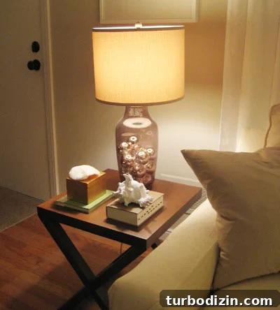 Glass lamp filled with silver ornaments