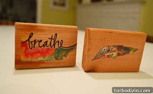 Two wooden blocks with tattoos