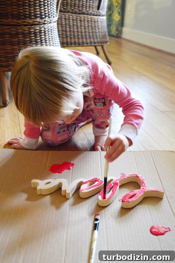 Playroom Finishing Touches: Stylish Ideas to Complete the Space 7 Painting name plaque with child