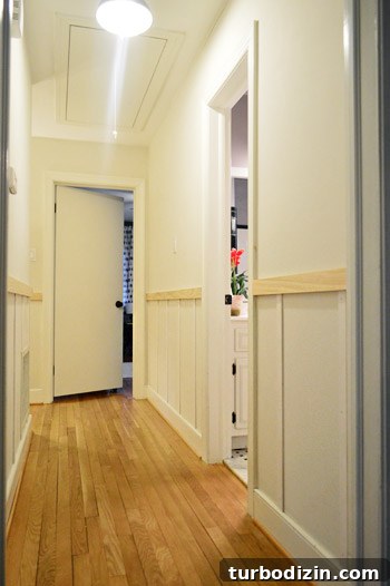 Board and Batten Wall Paneling for Under $60 13 progress on DIY board & batten project with vertical battens installed in hallway