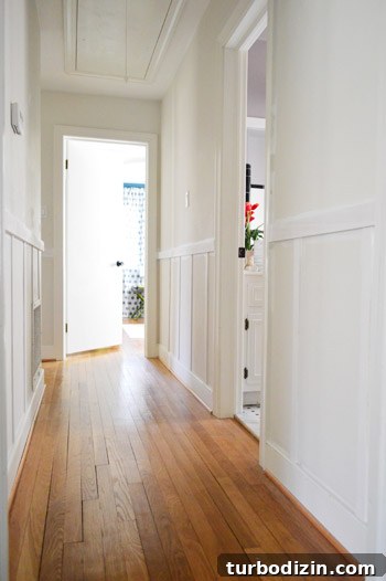 Board and Batten Wall Paneling for Under $60 16 do it yourself board and batten project installed in hallway before being painted