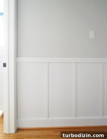 Board and Batten Wall Paneling for Under $60 21 straight on view of affordable do it yourself board and batten home improvement project