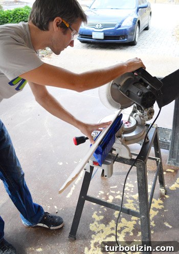 Crown Molding Installation Guide: Step-by-Step Tips for Perfect Results 12 John using miter saw to make cut on crown molding