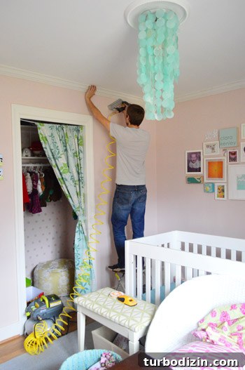 Crown Molding Installation Guide: Step-by-Step Tips for Perfect Results 13 John nailing crown molding to ceiling using compressor and nail gun