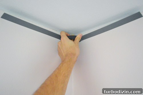 Crown Molding Installation Guide: Step-by-Step Tips for Perfect Results 7 John measuring corner of ceiling wall with angle finder tool
