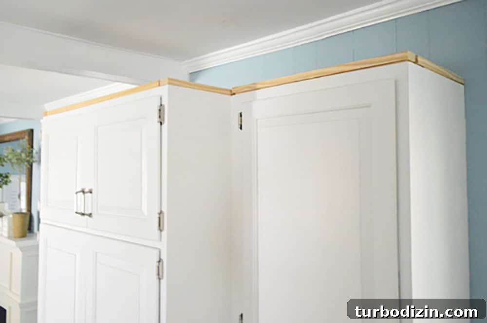 Add Crown Molding to Cabinets: Step-by-Step Guide for a Polished Finish 7 Scrap wood nailed along perimeter of upper cabinet in kitchen