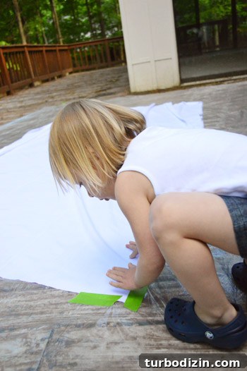 How to Create a Hand-Painted Fabric Backdrop at Home 6 Fabric taped down