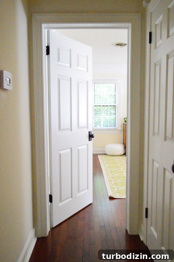 Child peeking through door hole