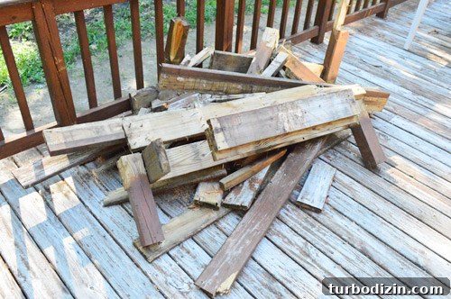 Fix a Hole in Your Deck: Step-by-Step Repair Guide 4 Pile of broken deck boards from hole repair