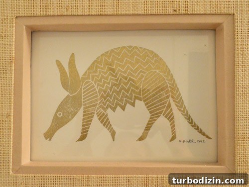 Refresh a Secondhand Bathroom Light: Stylish Upcycling Guide 3 framed armadillo print above sink