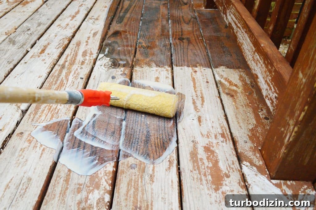 Rolling deck finish stripper onto wood deck