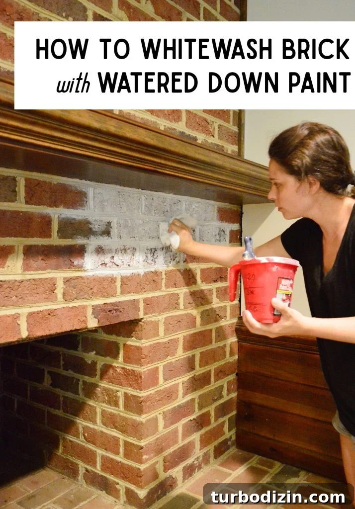 Whitewashing a Brick Fireplace: Step-by-Step Guide for a Fresh Look 3 Sherry dabbing watered down paint onto red brick fireplace for whitewash effect