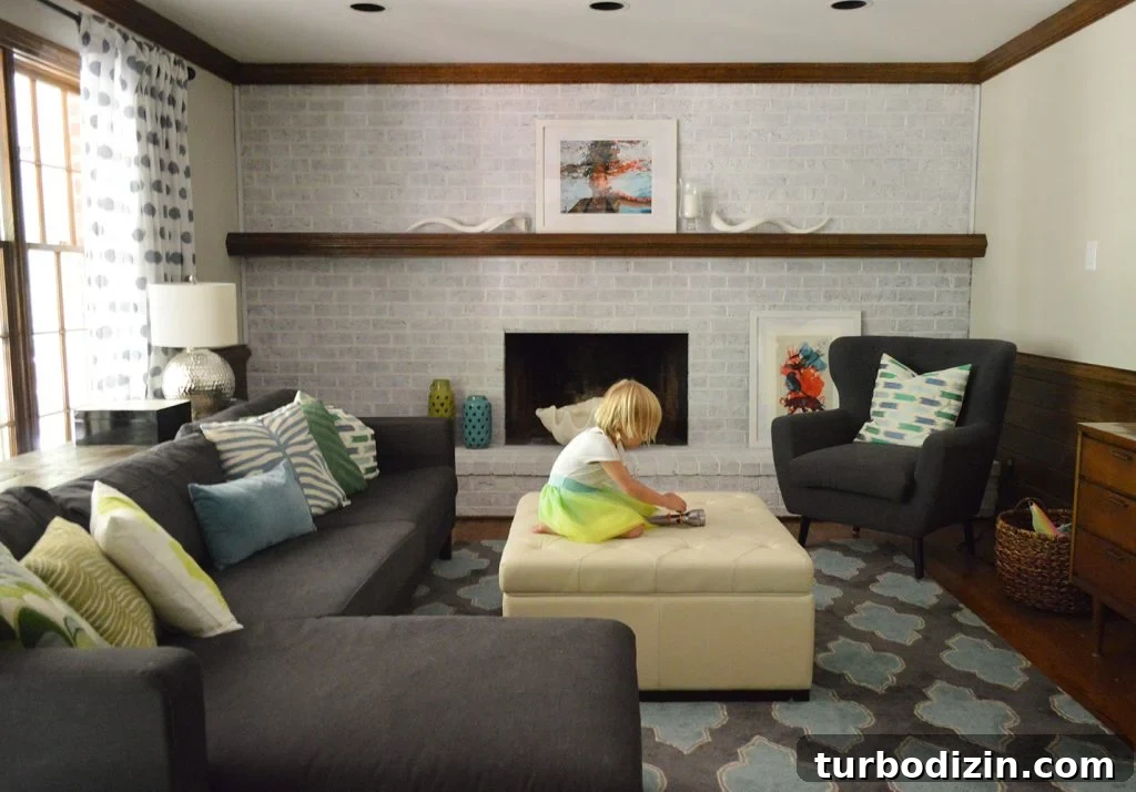 Whitewashing a Brick Fireplace: Step-by-Step Guide for a Fresh Look 4 living room with navy blue furniture and a whitewash brick fireplace wall