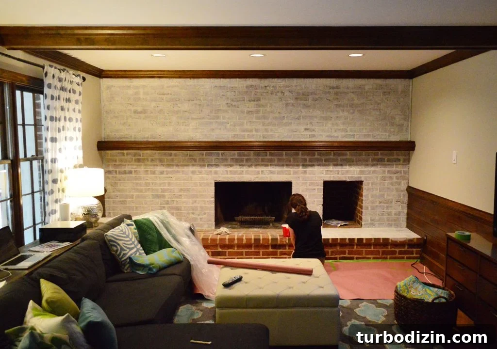 Whitewashing a Brick Fireplace: Step-by-Step Guide for a Fresh Look 9 nearly completed coat of whitewash paint technique on fireplace brick wall in dated living room