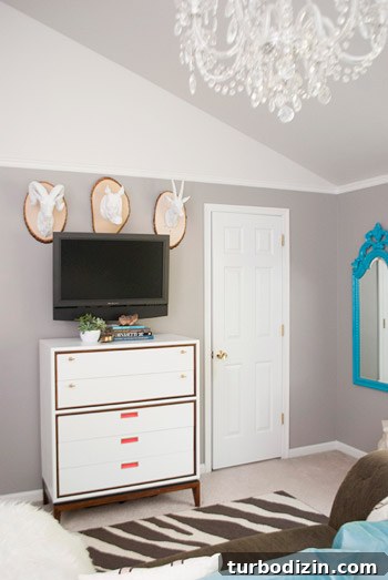 Painted dresser with mounted animal heads