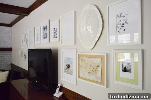 How to Arrange a Gallery Wall Around Your TV for Impact 2 Frames arranged on the floor