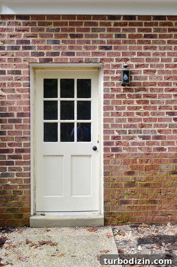 Old small exterior light by back door