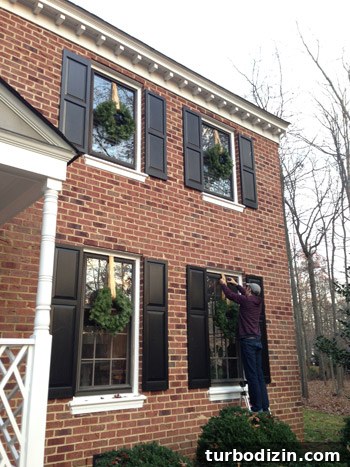 How to Hang Wreaths on Windows: Simple, Secure Methods 8 Hanging wreaths from ladder