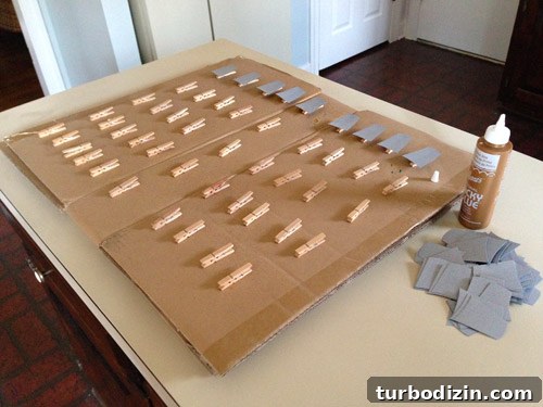 4 DIY Holiday Crafts to Transform Your Home This Season 12 Glueing gray paper light socket cut outs onto clothespin for Christmas craft garland
