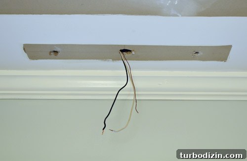 Wires sticking out of ceiling where fluorescent light fixture used to be