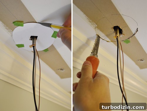 Cutting hole in ceiling for light fixture box using jab saw